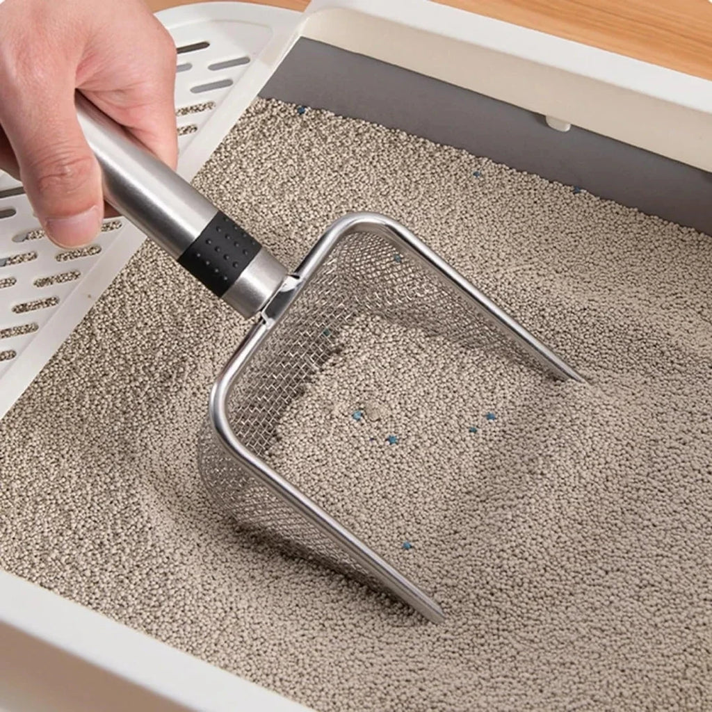 Pá higiênica aço inox para caixa de areia de gato em fundo branco