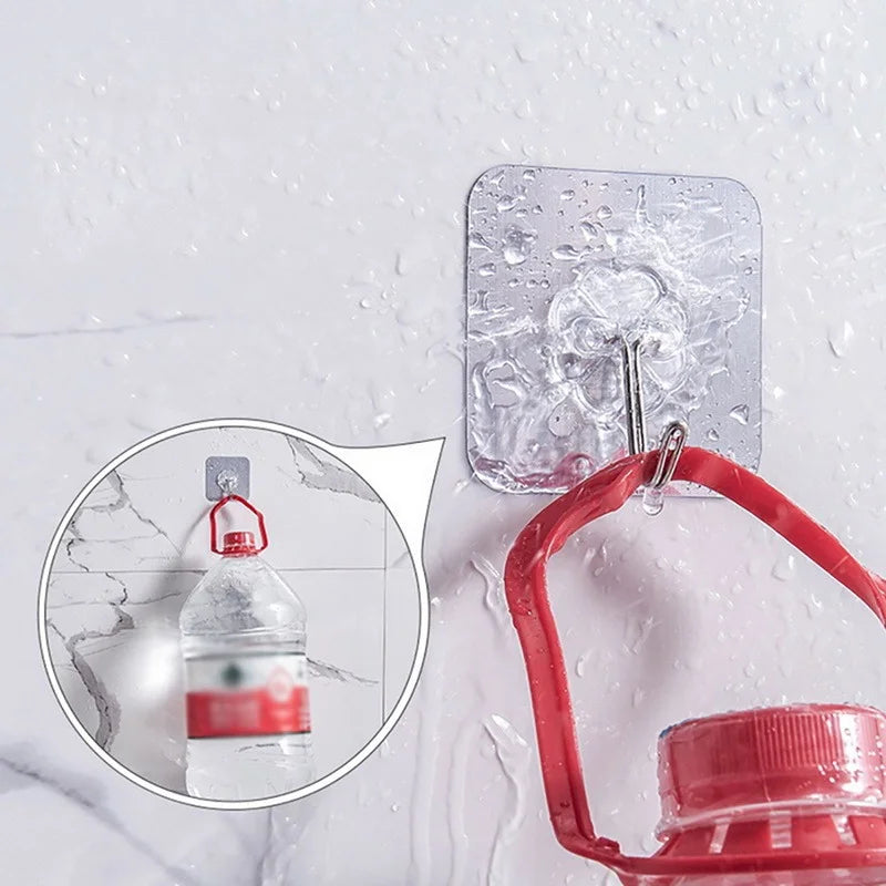 Kit de ganchos adesivos transparentes para parede em fundo branco